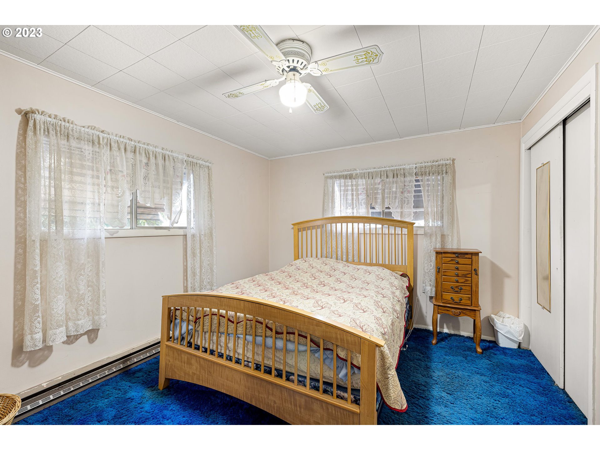 2500 J Street Springfield, OR 97477 - Photo 16 of 27 a bedroom with a bed and wooden floor