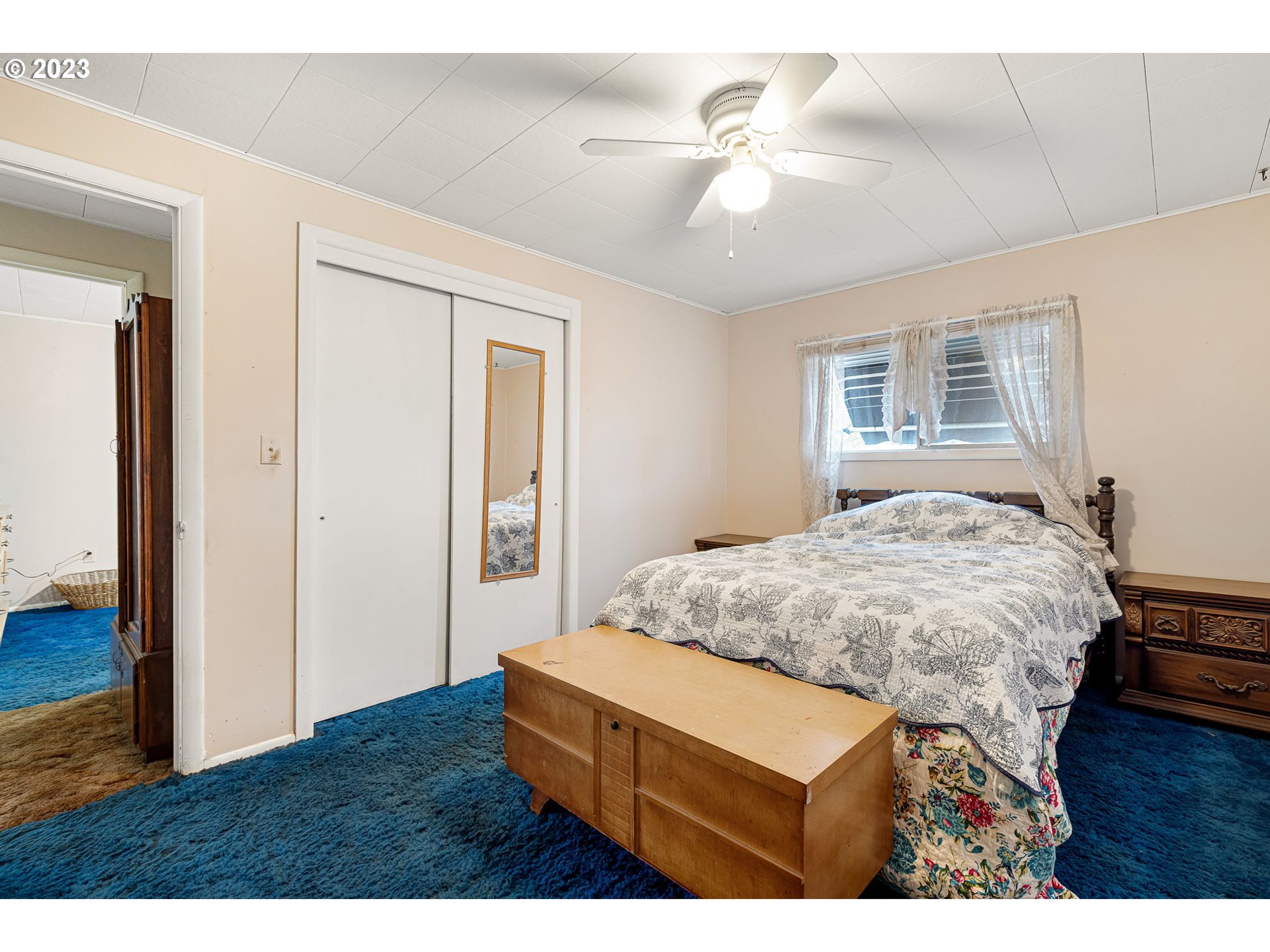 2500 J Street Springfield, OR 97477 - Photo 18 of 27 a bedroom with a bed and a chandelier