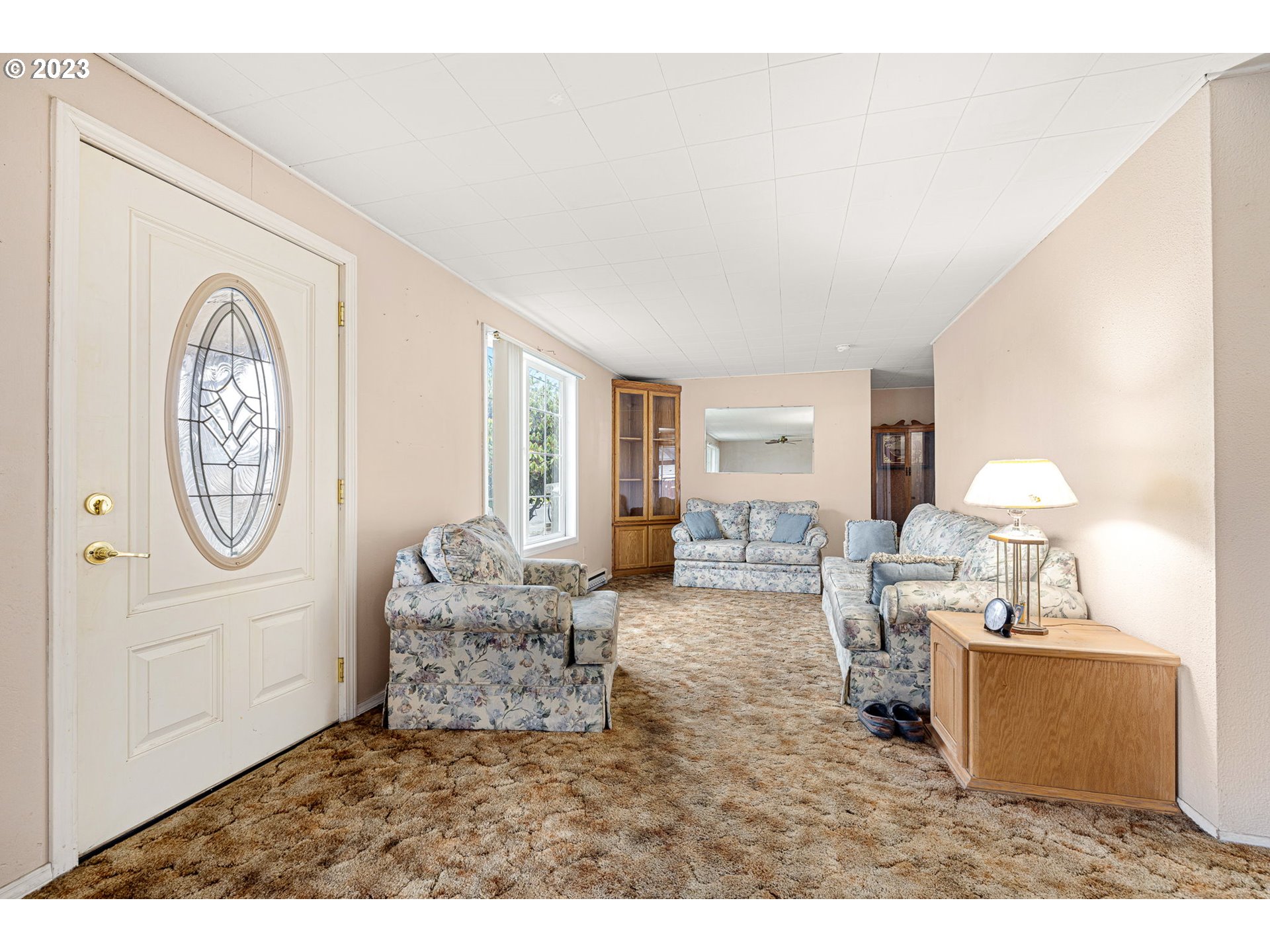 2500 J Street Springfield, OR 97477 - Photo 7 of 27 a living room with furniture a window and a clock