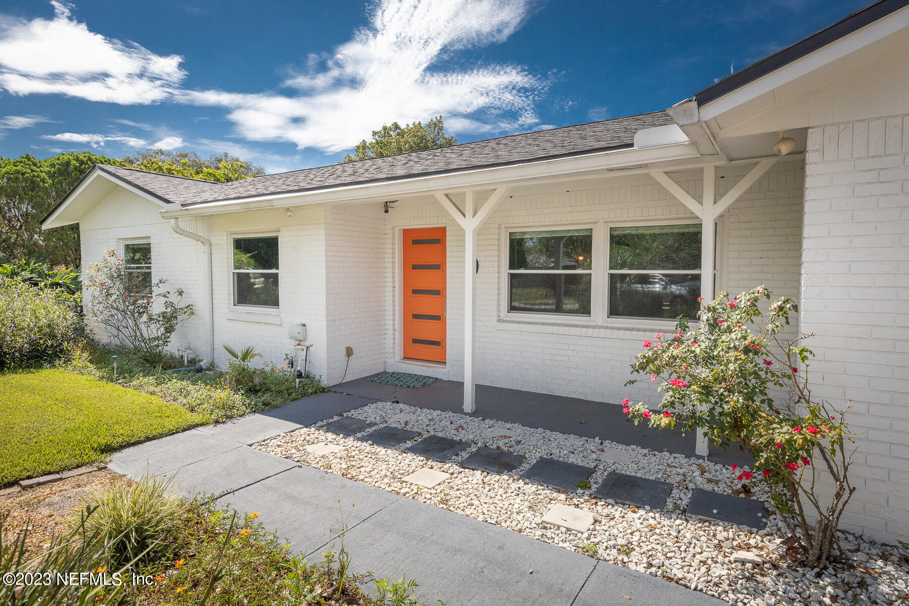 9 Amberjack Road Ponte Vedra Beach, FL 32082 - Photo 2 of 30 a house with flowers in front of it