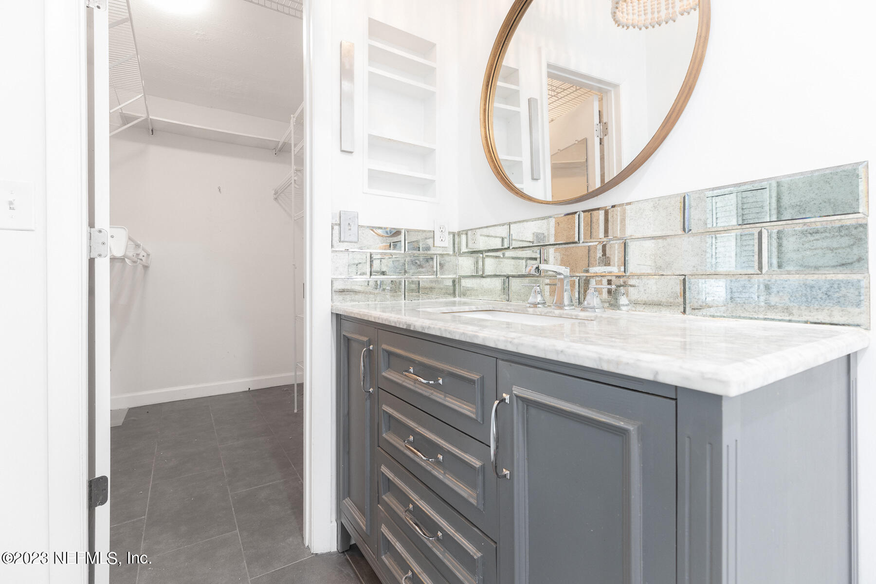 9 Amberjack Road Ponte Vedra Beach, FL 32082 - Photo 21 of 30 a bathroom with a granite countertop sink and a mirror