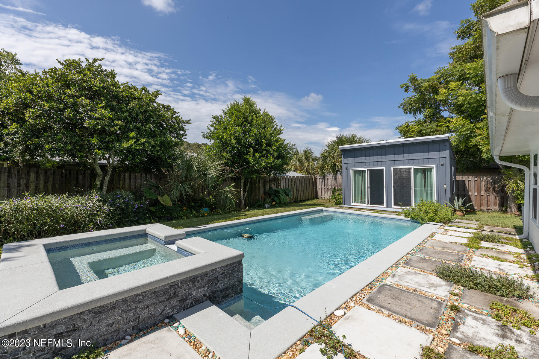9 Amberjack Road Ponte Vedra Beach, FL 32082 - Photo 23 of 30 a view of a house with swimming pool and a yard