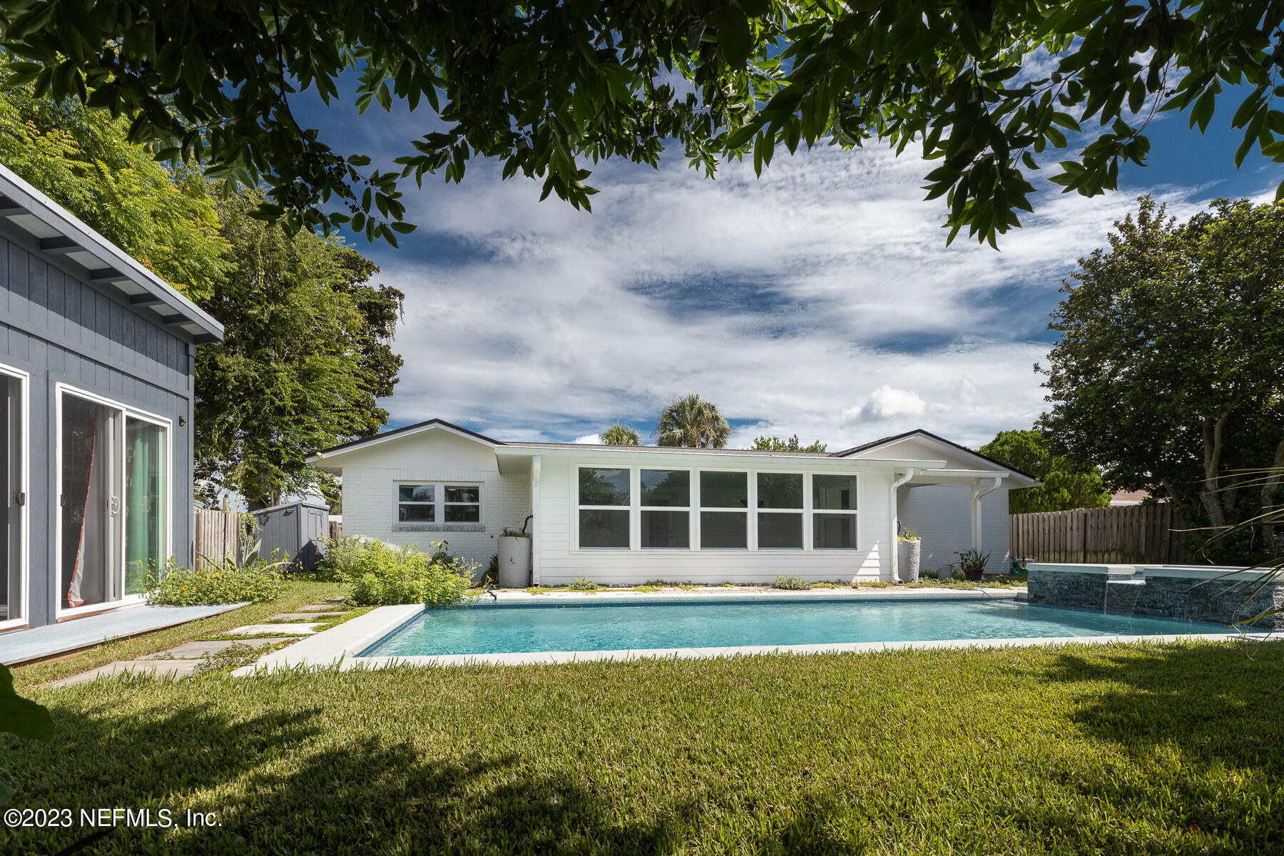 9 Amberjack Road Ponte Vedra Beach, FL 32082 - Photo 24 of 30 a front view of a house with a yard table and chairs