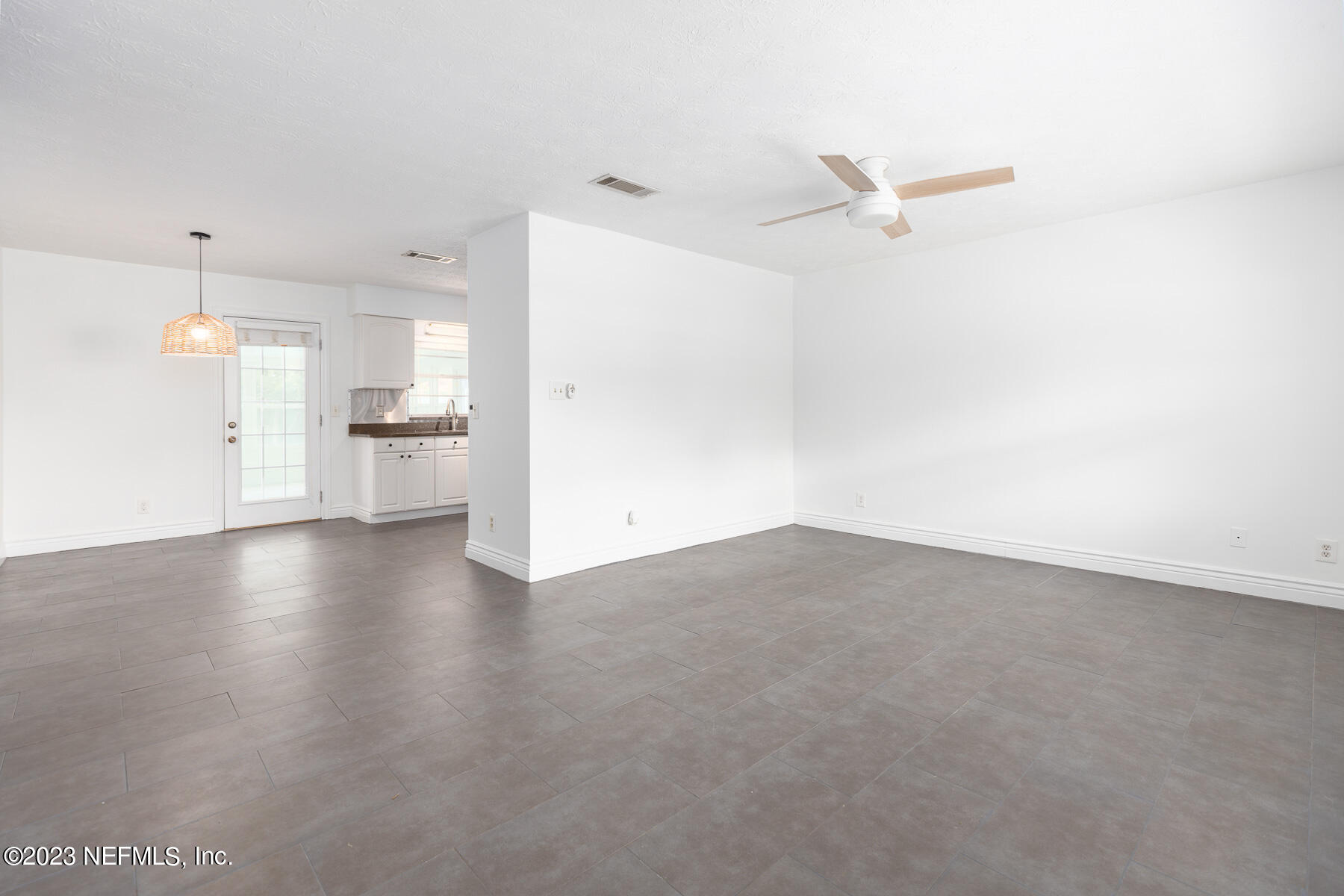 9 Amberjack Road Ponte Vedra Beach, FL 32082 - Photo 4 of 30 a view of a kitchen with a stove and a refrigerator