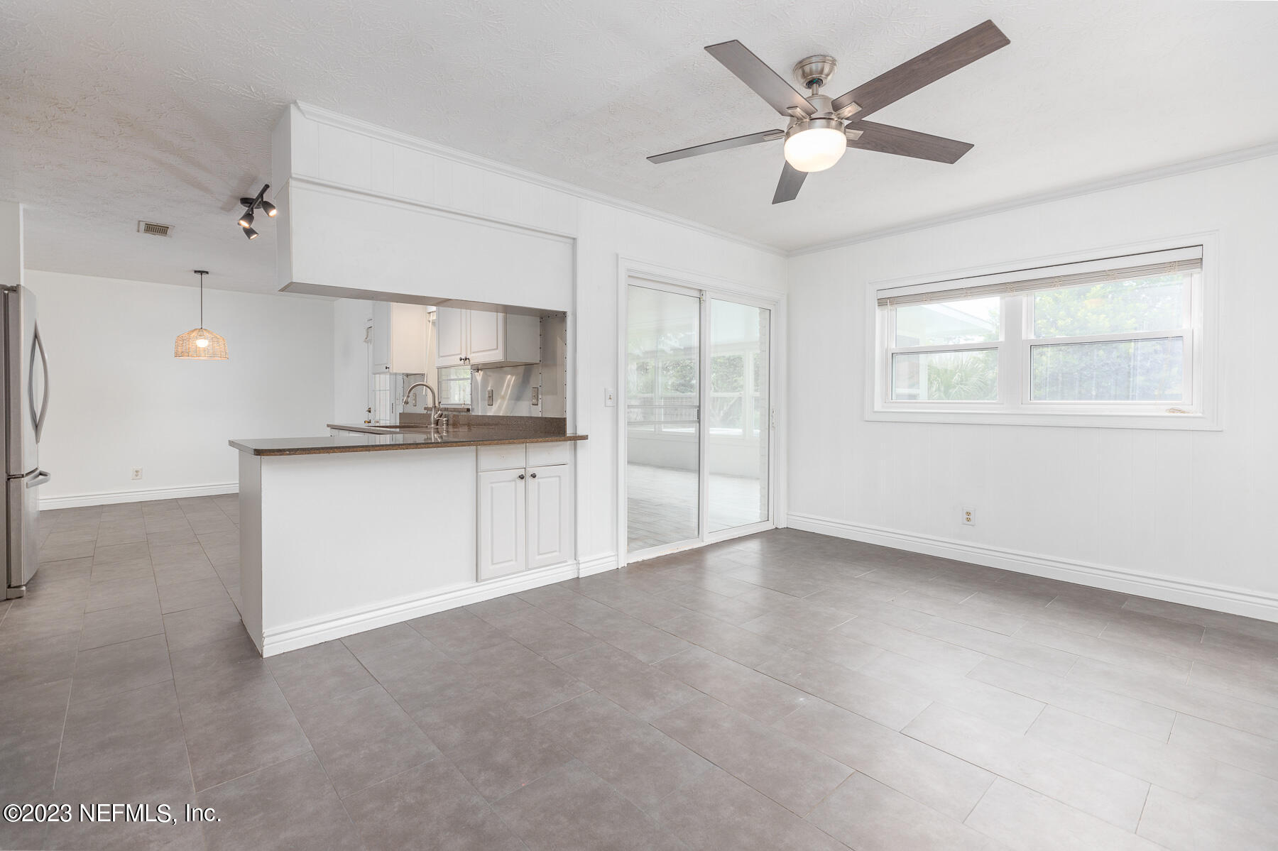 9 Amberjack Road Ponte Vedra Beach, FL 32082 - Photo 9 of 30 a view of a kitchen with a sink and a chandelier fan