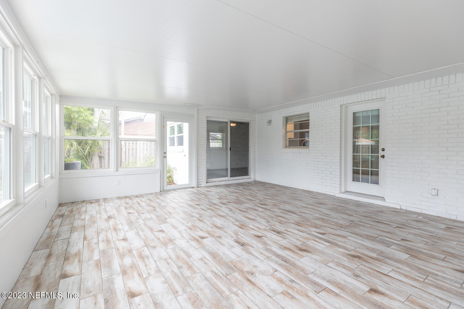 9 Amberjack Road Ponte Vedra Beach, FL 32082 - Photo 10 of 30 a view of an empty room with wooden floor and a window