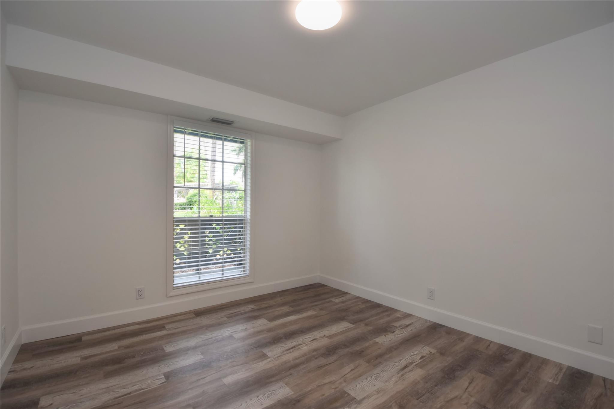 5064 Heatherhill Lane, Unit 7 Boca Raton, FL 33486 - Photo 21 of 33 2nd bedroom looks out to patio