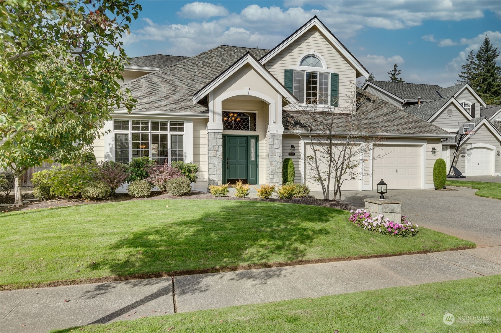 a front view of a house with a yard