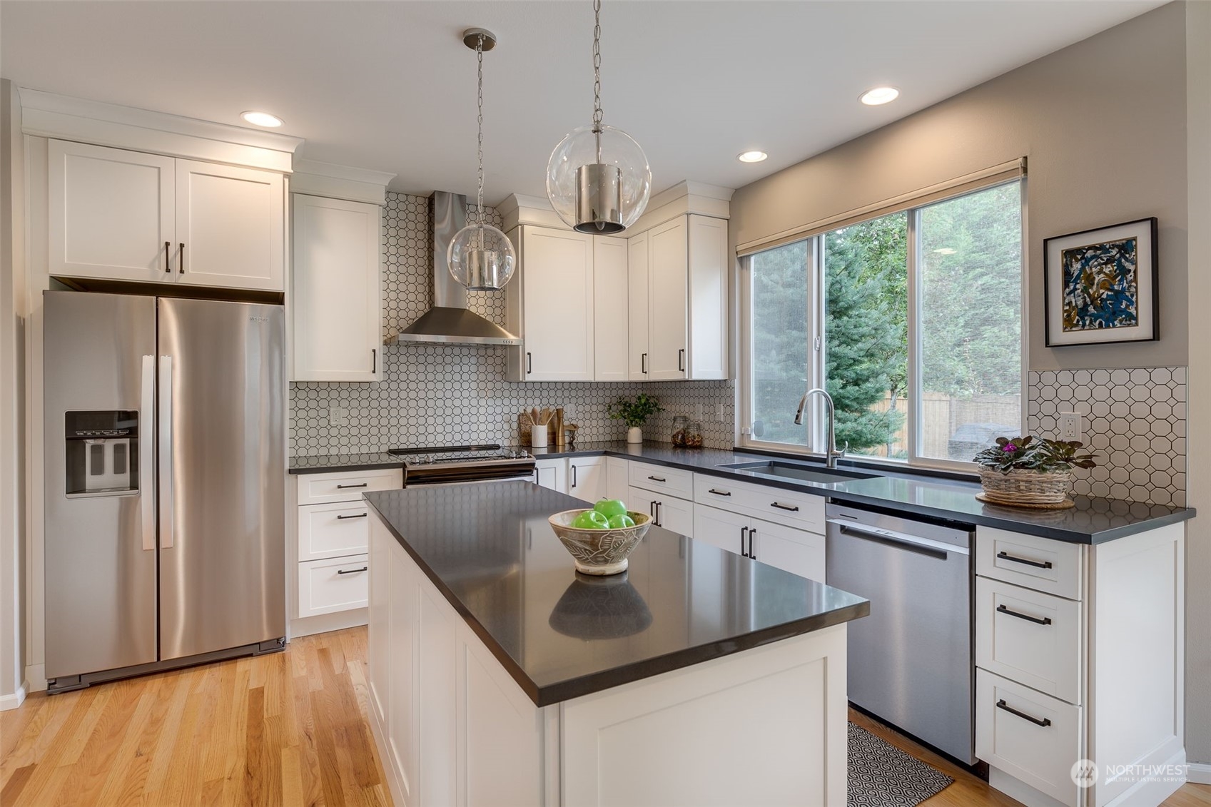 20022 27th Drive Southeast Bothell, WA 98012 - Photo 11 of 37 a kitchen with stainless steel appliances granite countertop a sink stove and refrigerator
