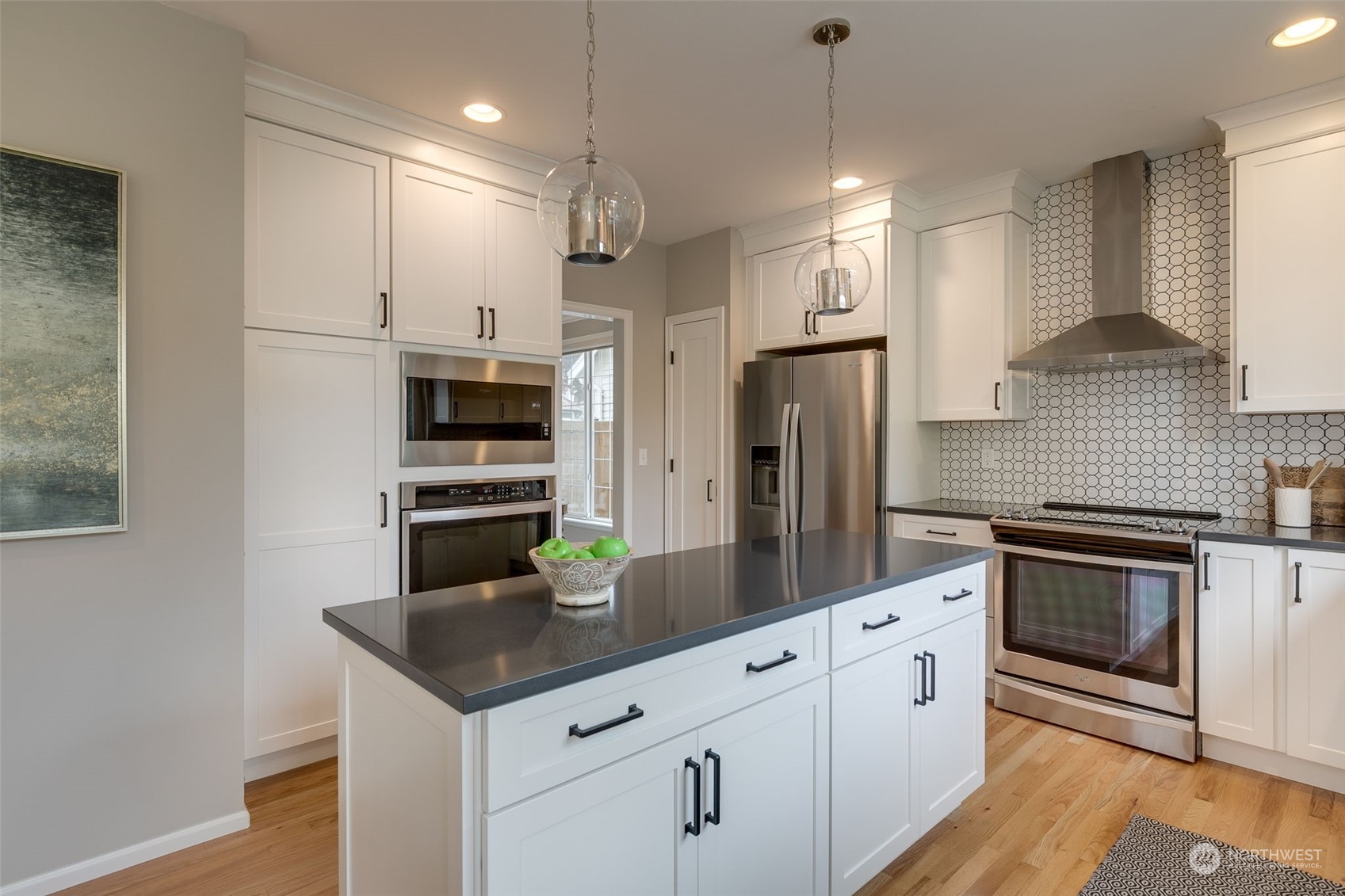 20022 27th Drive Southeast Bothell, WA 98012 - Photo 12 of 37 a kitchen with stainless steel appliances granite countertop a sink a stove a refrigerator and island