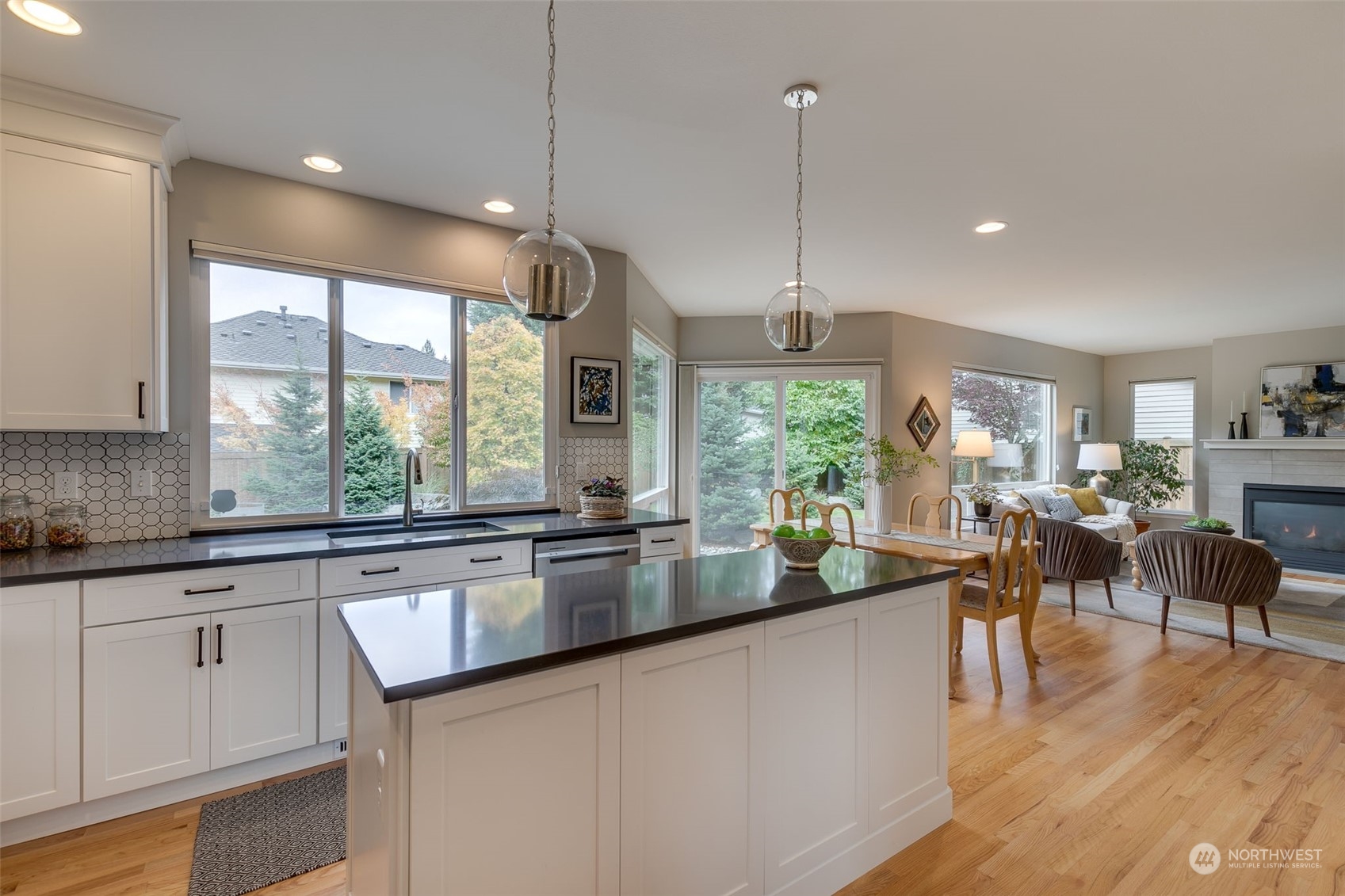 20022 27th Drive Southeast Bothell, WA 98012 - Photo 13 of 37 a very nice looking kitchen with granite countertop a stove a sink a dining table and chairs
