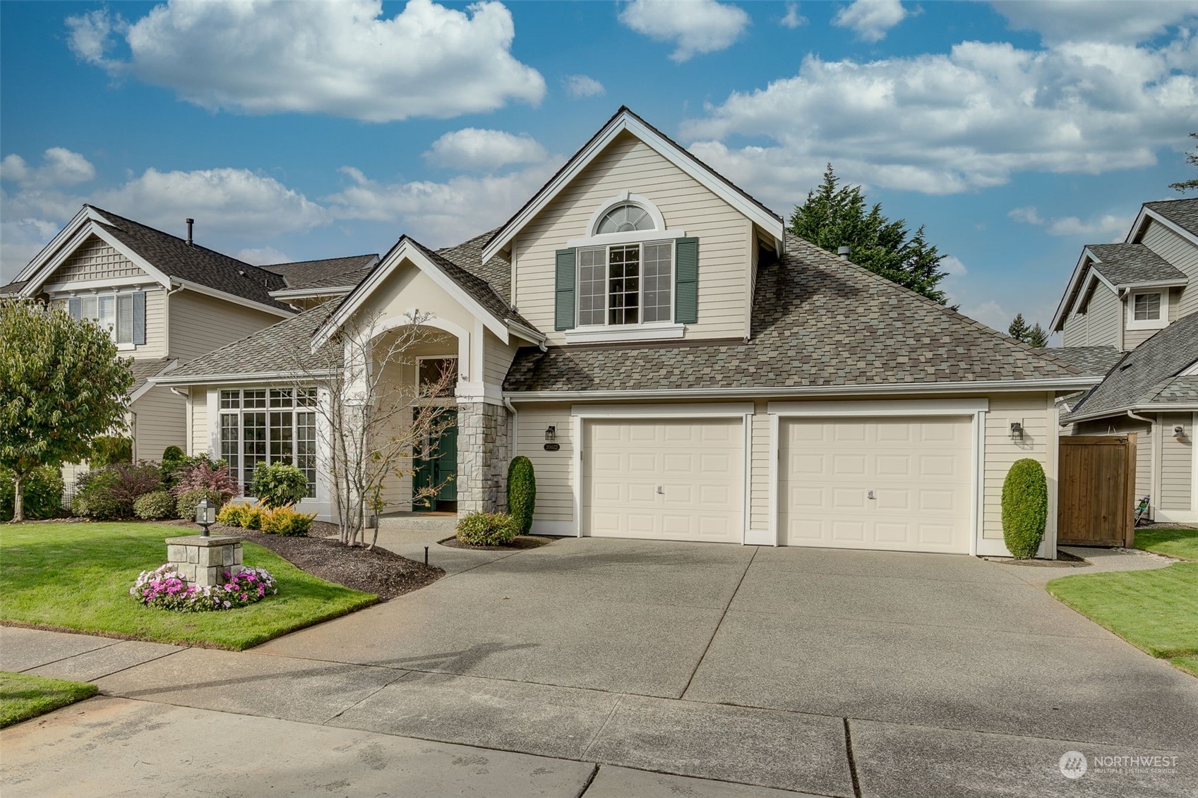 20022 27th Drive Southeast Bothell, WA 98012 - Photo 2 of 37 a front view of a house with a yard and garage