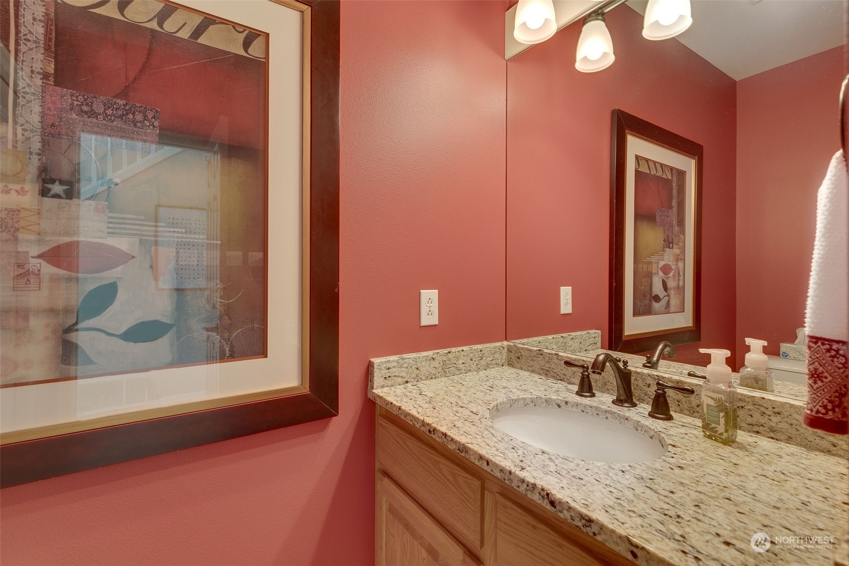 20022 27th Drive Southeast Bothell, WA 98012 - Photo 24 of 37 a bathroom with a granite countertop sink and a mirror