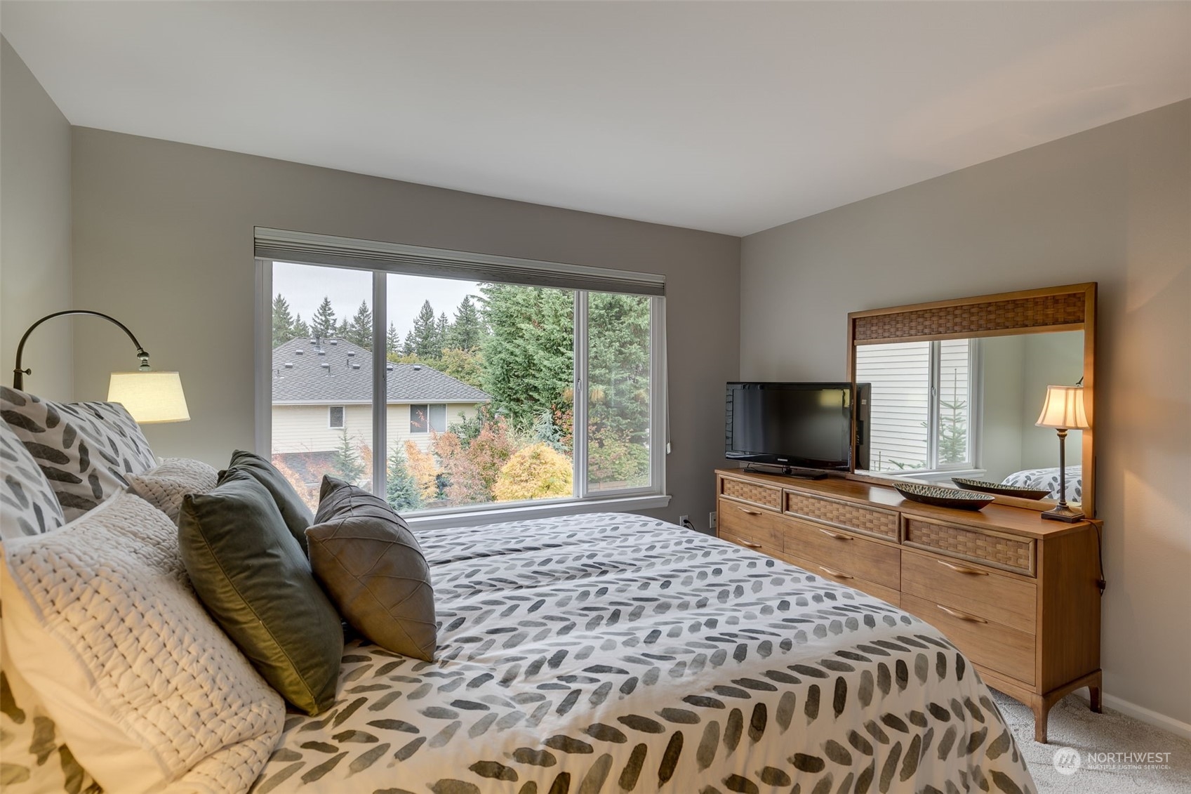20022 27th Drive Southeast Bothell, WA 98012 - Photo 26 of 37 a bedroom with a bed and large windows