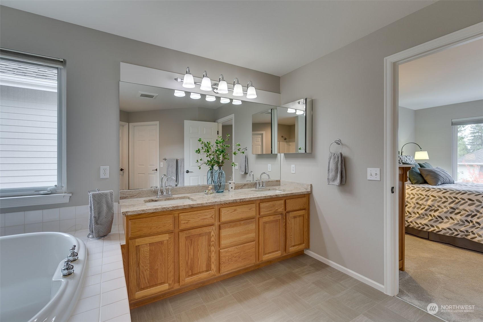 20022 27th Drive Southeast Bothell, WA 98012 - Photo 27 of 37 a spacious bathroom with a granite countertop sink and a mirror