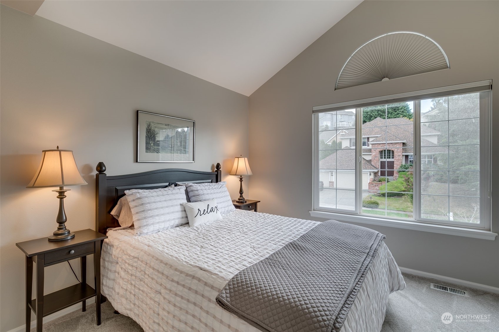 20022 27th Drive Southeast Bothell, WA 98012 - Photo 30 of 37 a bedroom with a bed and a lamp next to a window