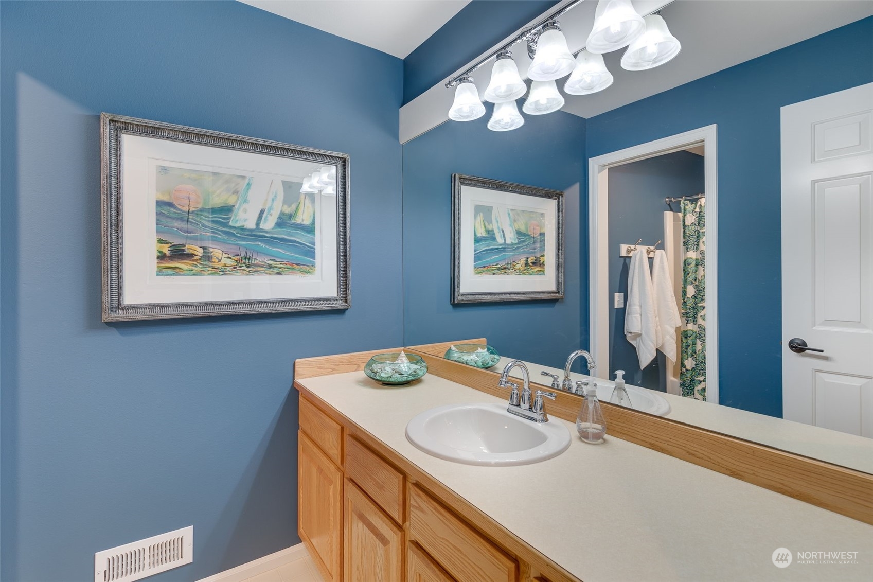 20022 27th Drive Southeast Bothell, WA 98012 - Photo 31 of 37 a bathroom with a sink and a mirror