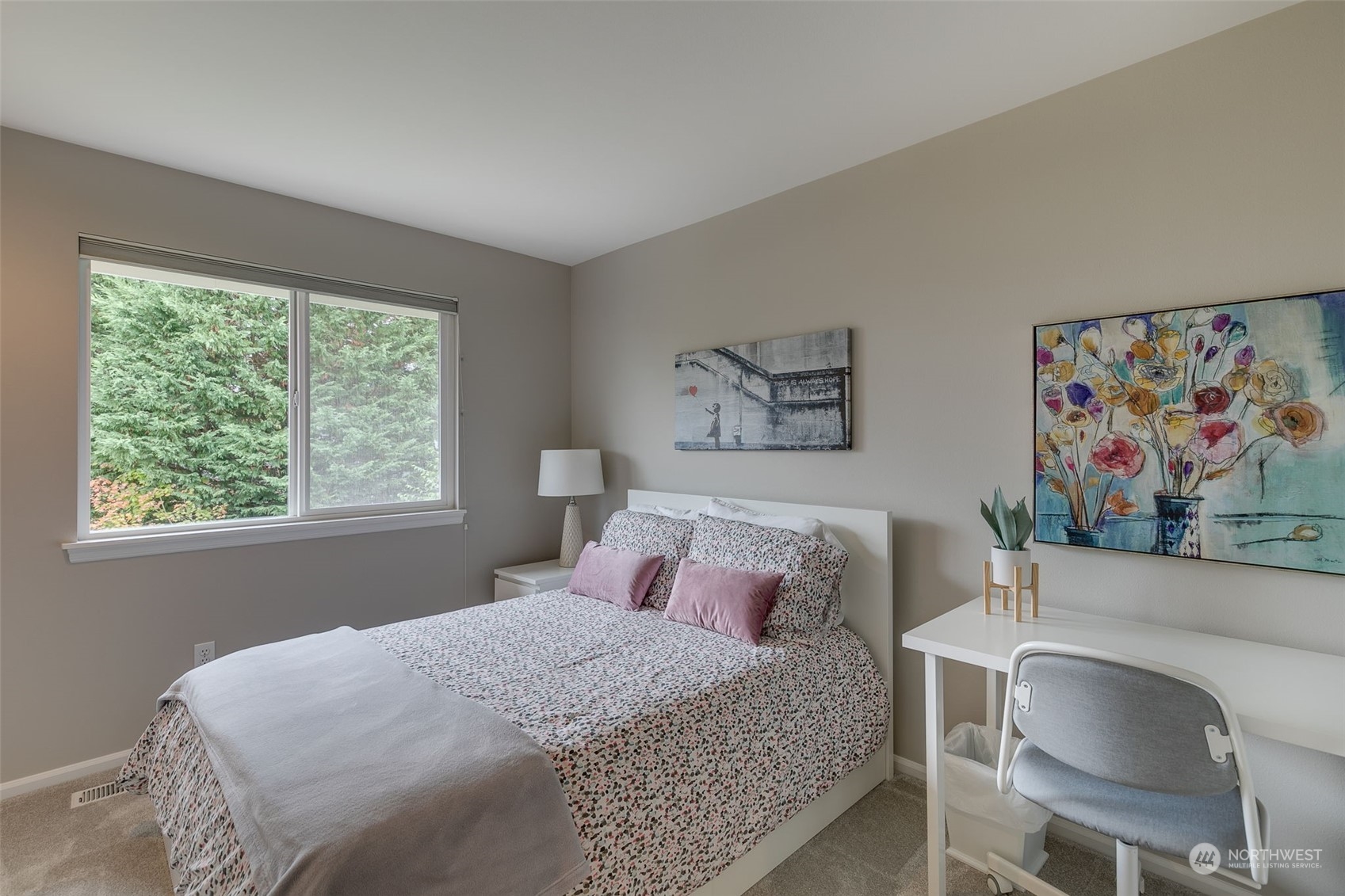 20022 27th Drive Southeast Bothell, WA 98012 - Photo 33 of 37 a bedroom with a bed and a painting on the wall