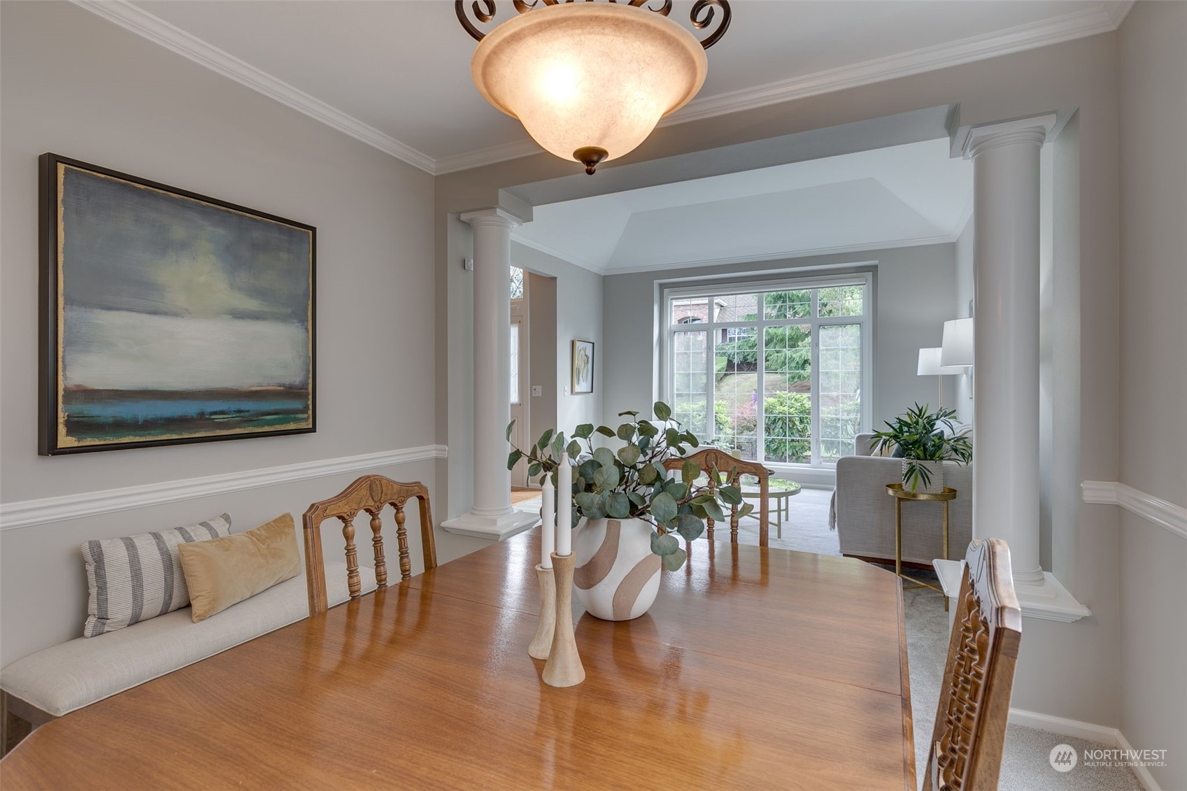 20022 27th Drive Southeast Bothell, WA 98012 - Photo 9 of 37 a dining room with furniture potted plants and wooden floor