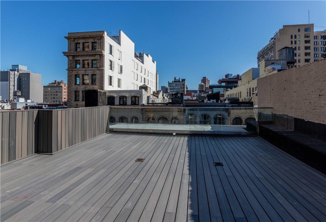 391 Broadway Manhattan, NY 10013 - Photo 1 of 1 a view of a balcony with wooden floor