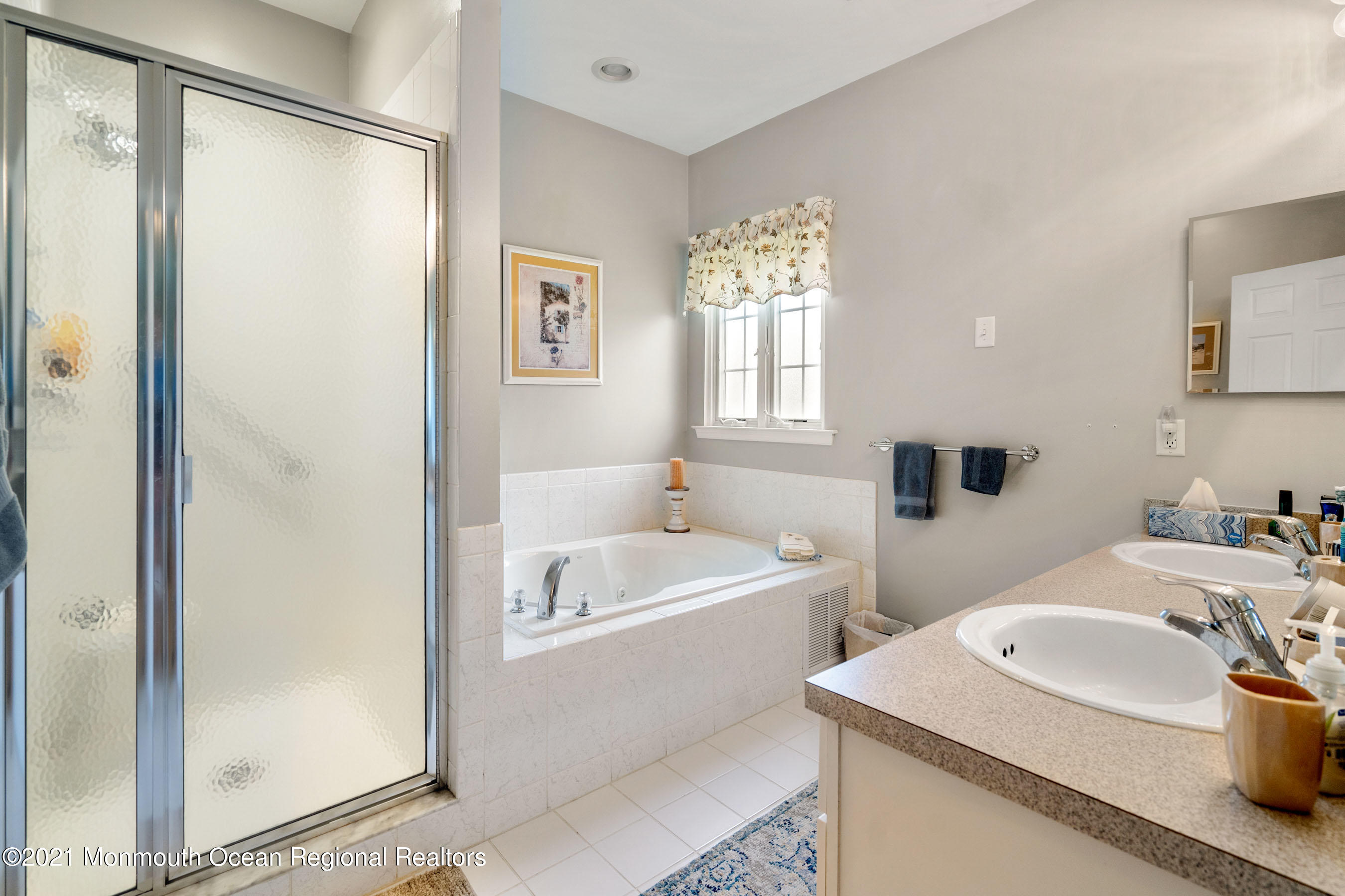 7 Millstone Way Waretown, NJ 08758 - Photo 18 of 45 a bathroom with a sink and a bathtub