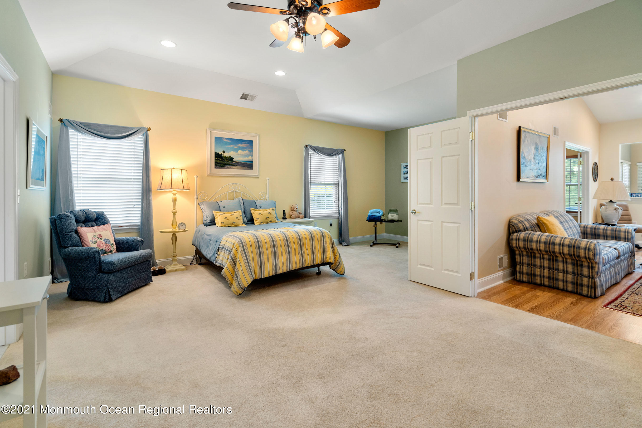 7 Millstone Way Waretown, NJ 08758 - Photo 20 of 45 a spacious bedroom with a bed and a chandelier