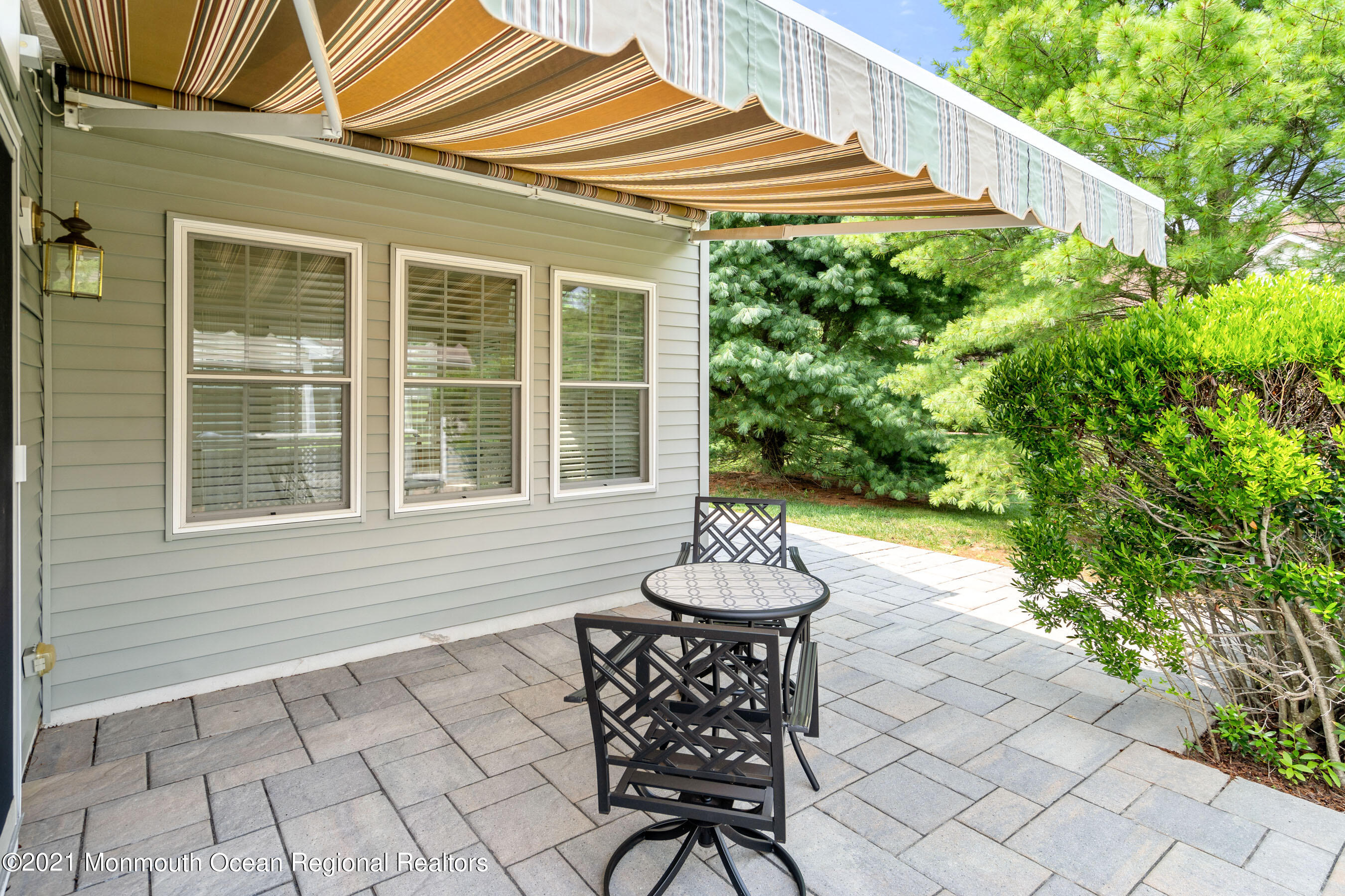7 Millstone Way Waretown, NJ 08758 - Photo 24 of 45 a backyard of a house with table and chairs