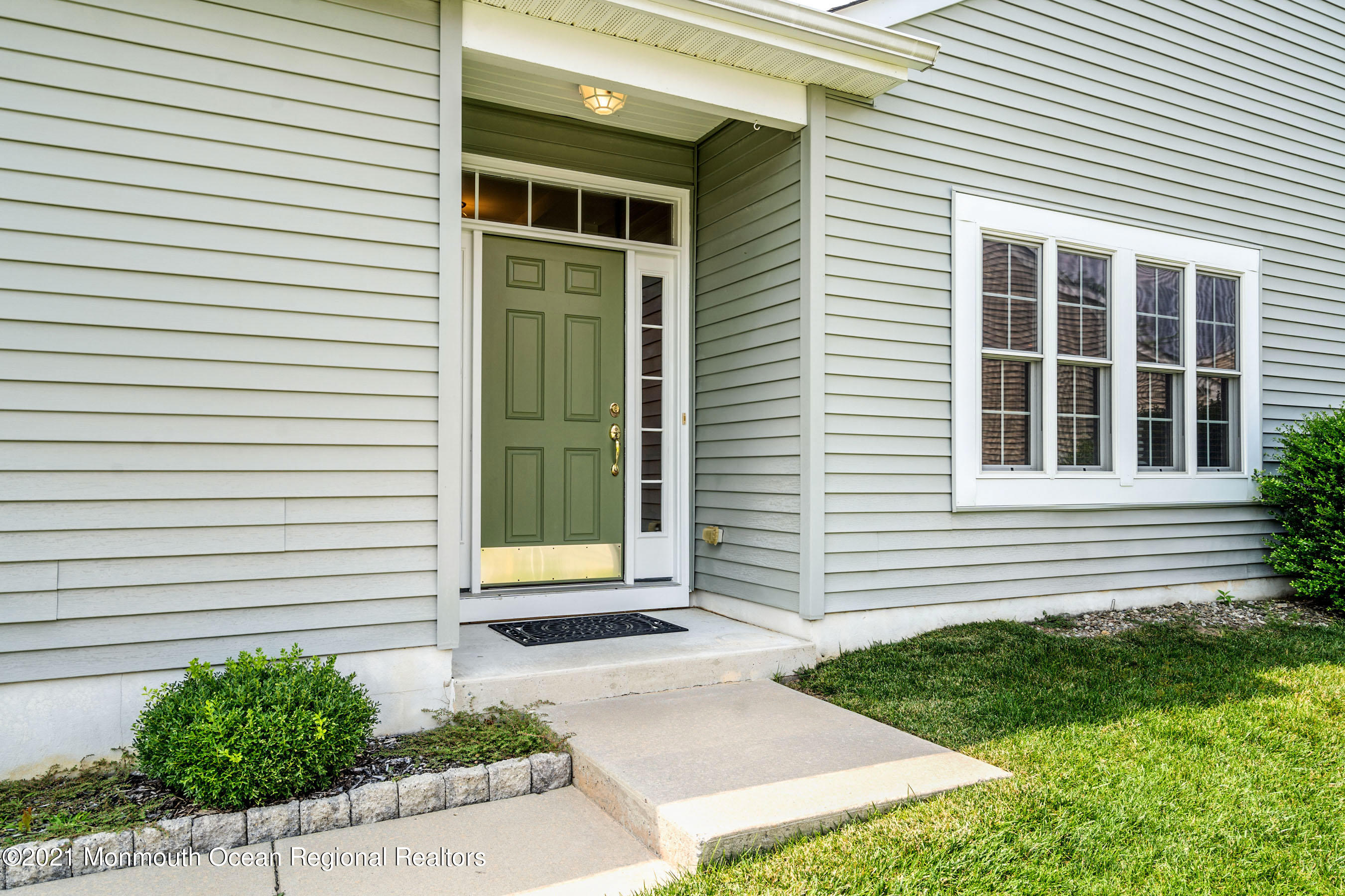 7 Millstone Way Waretown, NJ 08758 - Photo 4 of 45 a front view of a house with a yard