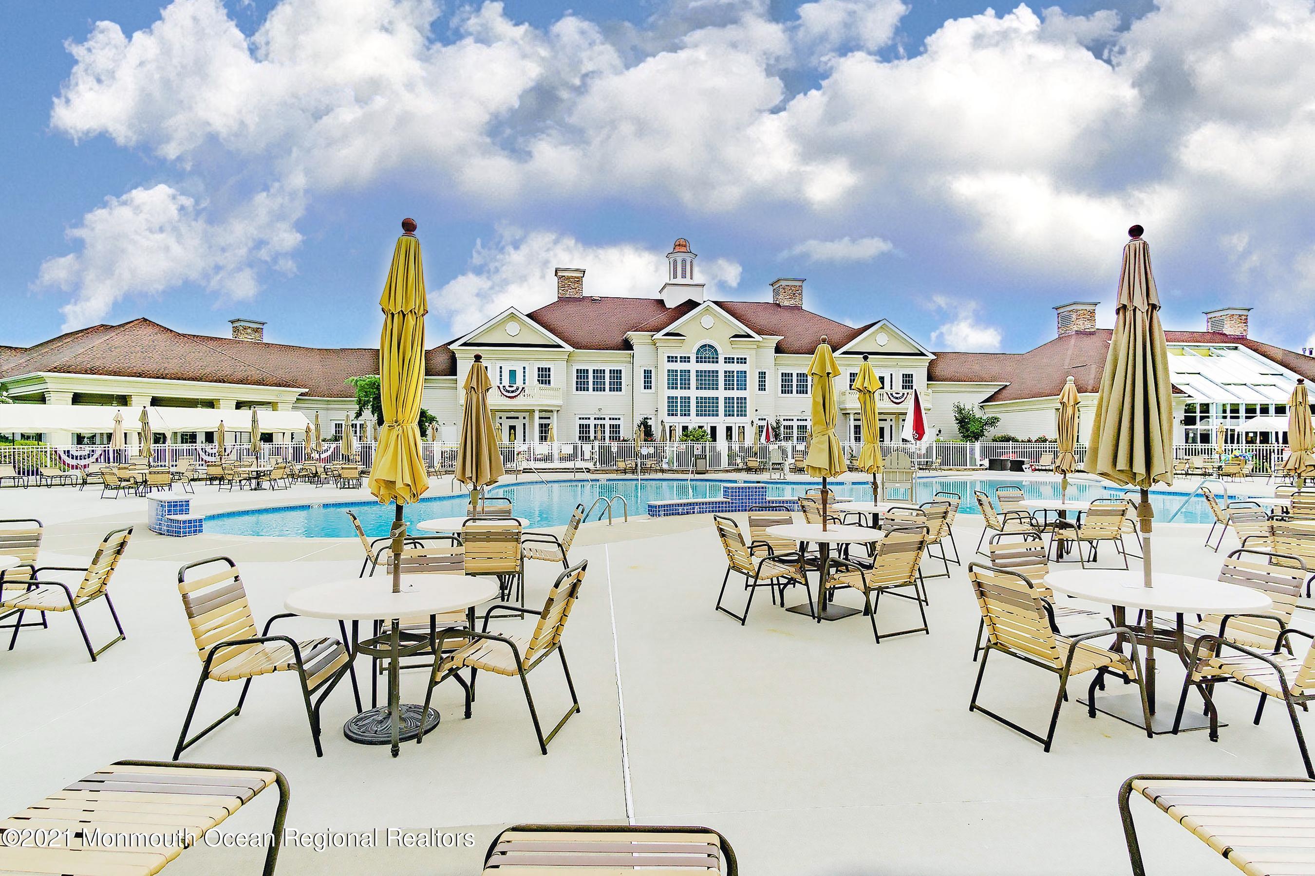 7 Millstone Way Waretown, NJ 08758 - Photo 38 of 45 a view of a patio with dining table and chairs