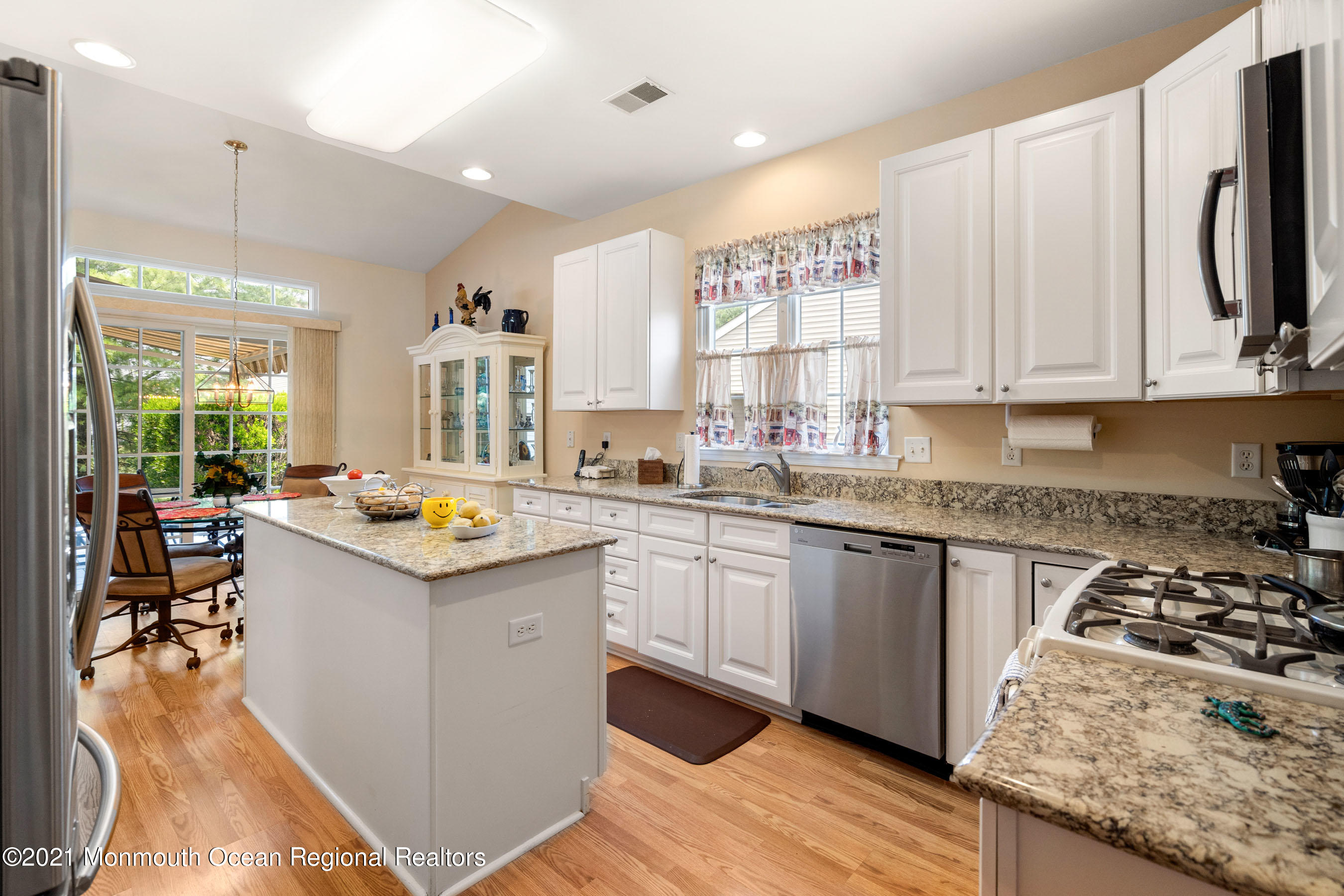 7 Millstone Way Waretown, NJ 08758 - Photo 7 of 45 a kitchen with granite countertop a sink stove and cabinets