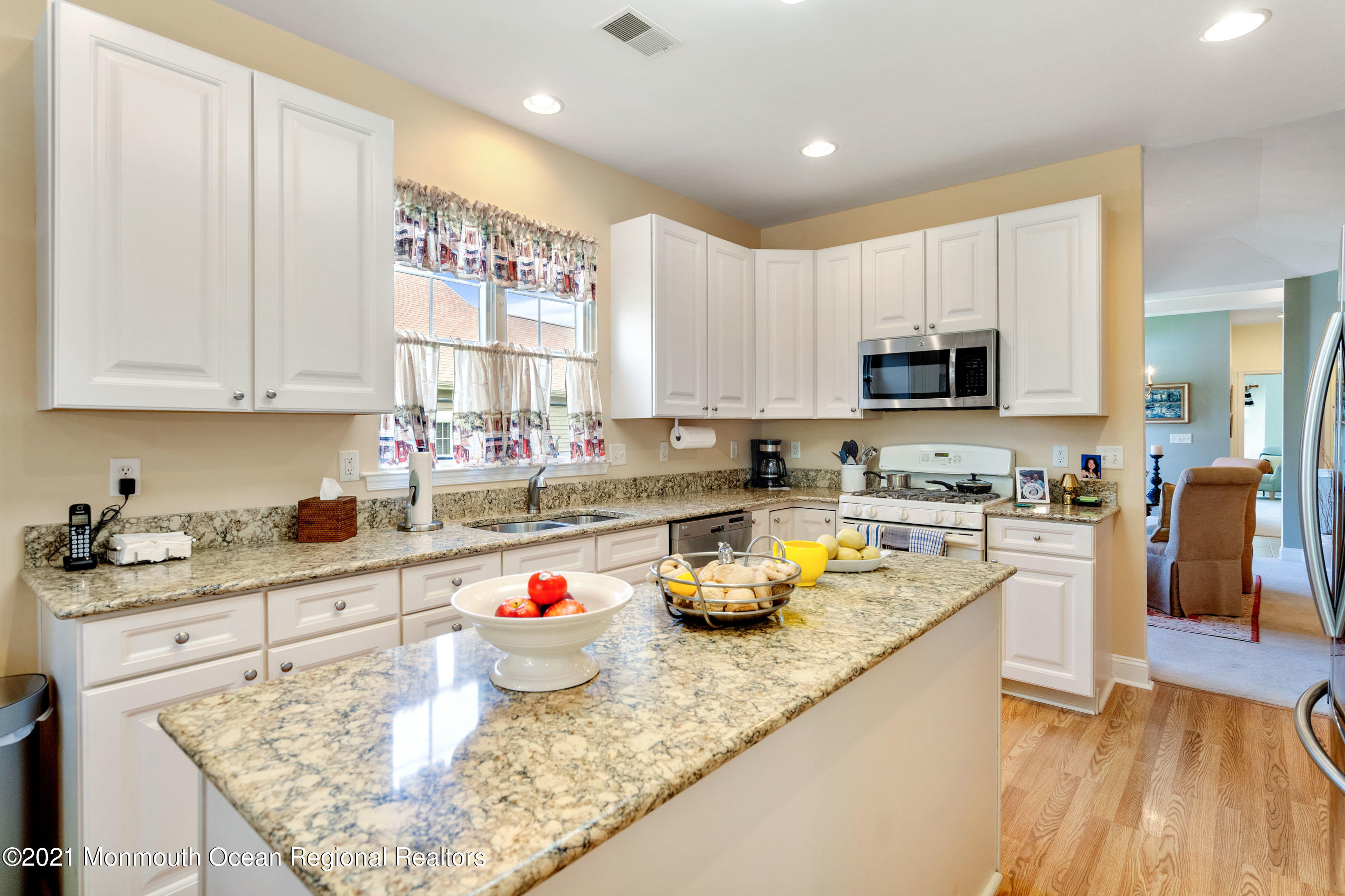 7 Millstone Way Waretown, NJ 08758 - Photo 9 of 45 a kitchen with a sink a stove and cabinets