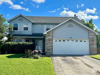 416 Fawn Lane Oswego, IL 60543 - Photo 1 of 13 a view of a house with yard and a garden