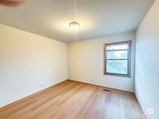 416 Fawn Lane Oswego, IL 60543 - Photo 13 of 13 an empty room with a window