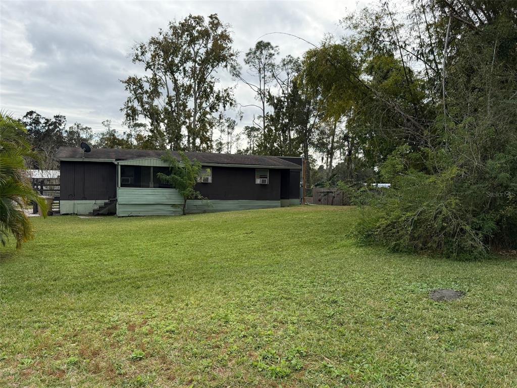 5071 Hibiscus Road Kissimmee, FL 34746 - Photo 9 of 12 a front view of a house with a garden