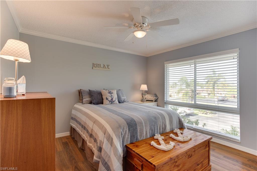 195 Harrison Road, Unit 4 Naples, FL 34112 - Photo 18 of 31 Bright and cheery guest bedroom!