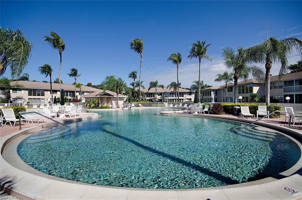 195 Harrison Road, Unit 4 Naples, FL 34112 - Photo 24 of 31 Large community pool for laps or relaxation!