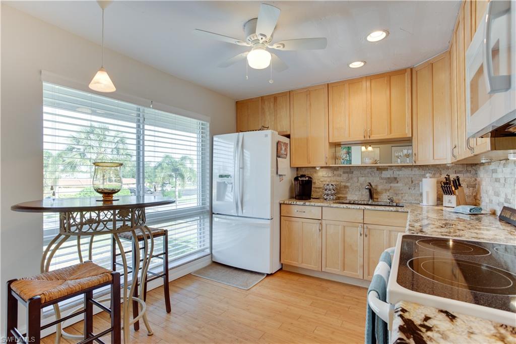 195 Harrison Road, Unit 4 Naples, FL 34112 - Photo 8 of 31 Beautiful bright kitchen with plenty of storage