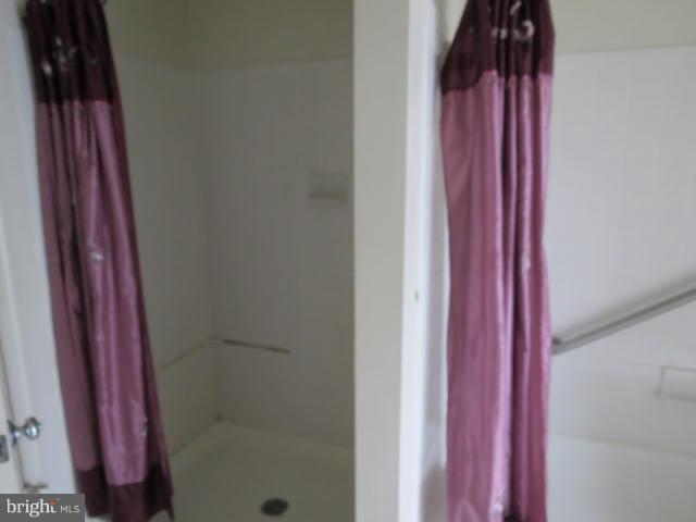 2126 Queensguard Road Silver Spring, MD 20906 - Photo 14 of 25 a bathroom with a shower and a mirror