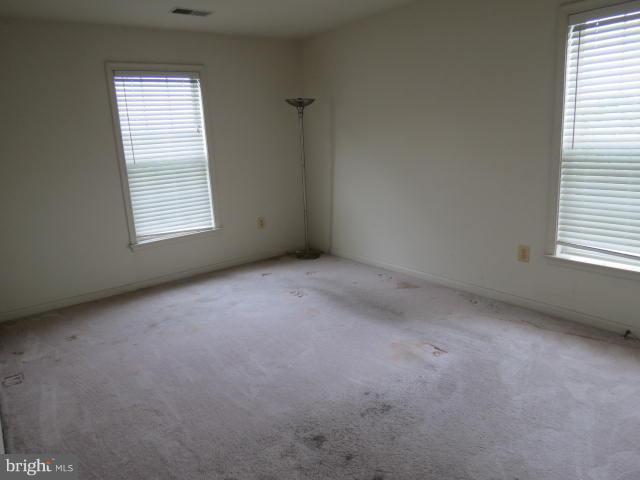 2126 Queensguard Road Silver Spring, MD 20906 - Photo 15 of 25 an empty room with a window