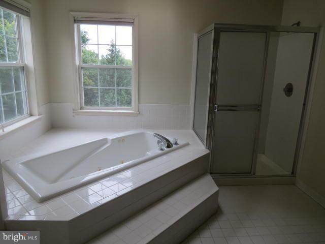 2126 Queensguard Road Silver Spring, MD 20906 - Photo 19 of 25 a bathroom with a bathtub and shower