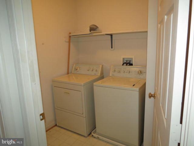 2126 Queensguard Road Silver Spring, MD 20906 - Photo 20 of 25 a utility room with dryer and washer