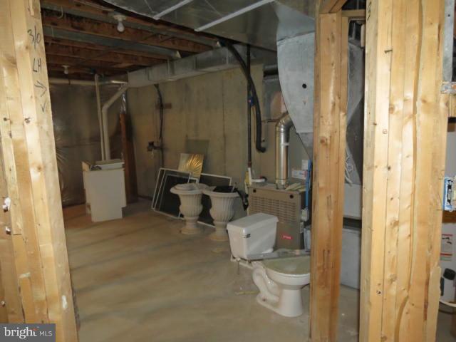 2126 Queensguard Road Silver Spring, MD 20906 - Photo 23 of 25 a bathroom with a toilet and a shower