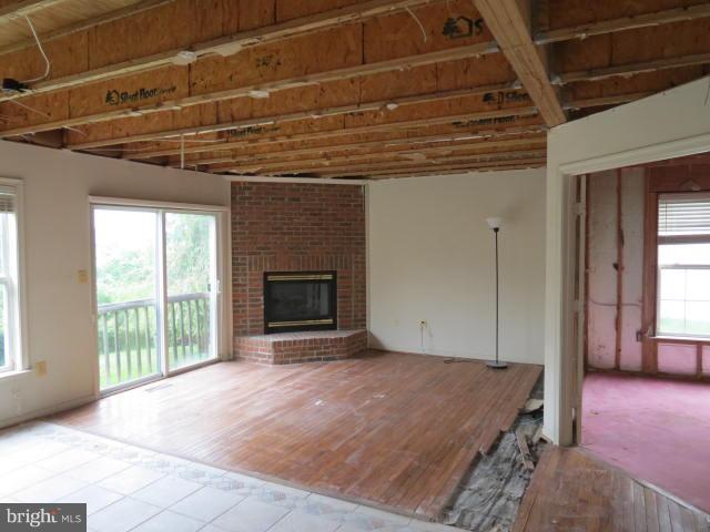 2126 Queensguard Road Silver Spring, MD 20906 - Photo 7 of 25 a view of livingroom with an empty space and a fireplace
