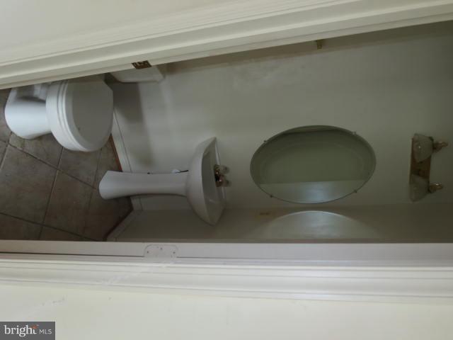 2126 Queensguard Road Silver Spring, MD 20906 - Photo 9 of 25 a bathroom with a toilet and a sink