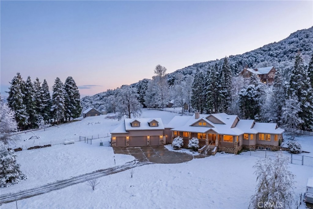 11821 Raspberry Lane Oak Glen, CA 92399 - Photo 49 of 49 Snow is AI generated. This property does receive snowfall. It was not snowing the day of this photo.