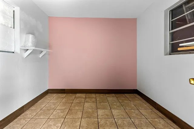 a view of a room with wooden floor and small space