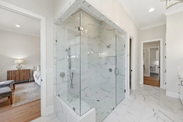 a bathroom with a shower and a sink