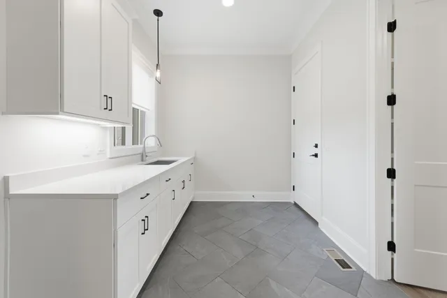 a bathroom with a double vanity sink and mirror