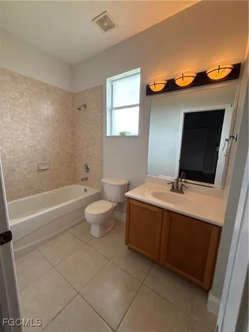 a bathroom with a sink a toilet and a shower
