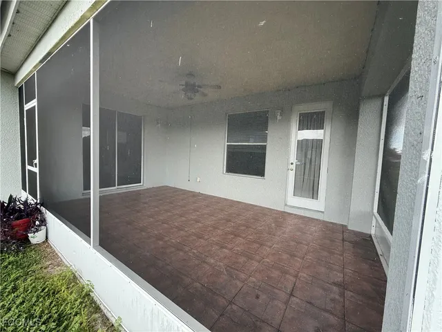 a view of a backyard with large trees